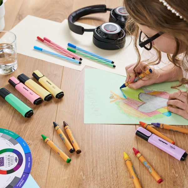 Child colouring with world of colour wax crayons, Pro:scribe highlighters and Icon colour wheel - stationery superstore uk
